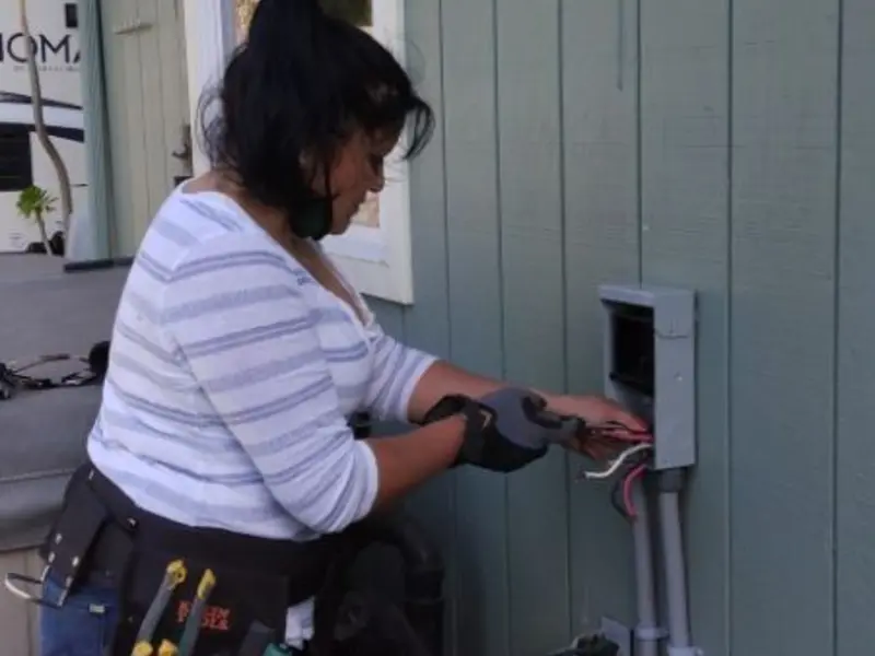 Licensed electrician wiring an exterior subpanel in Winfield